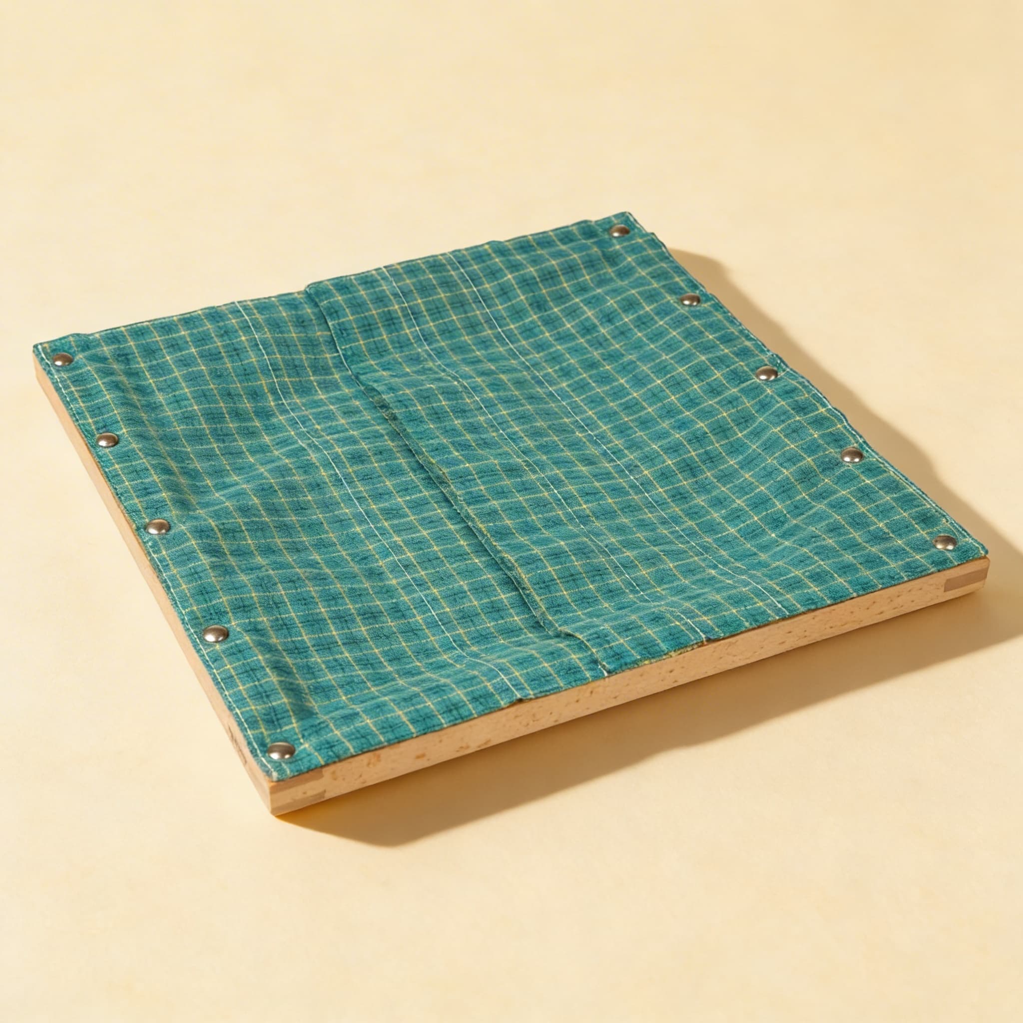 Hook And Eye Frame — Metal Fasteners on Turquoise Plaid Fabric