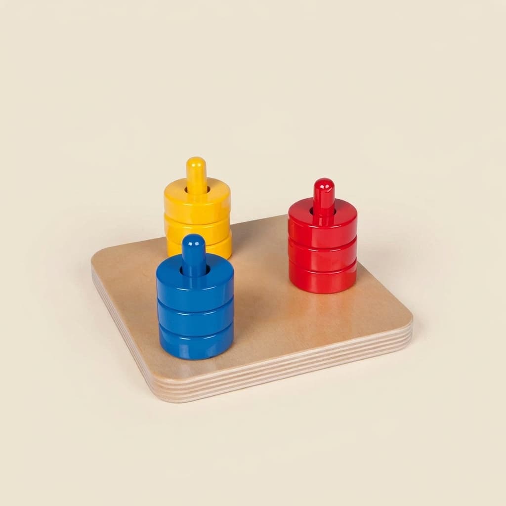 Barevné kotouče na kolíčcích: skládání a třídění pro batolata - Montessori Material | Faborino